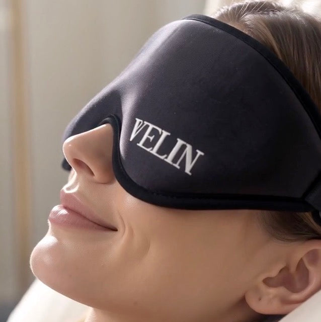Woman smiling while wearing the VELIN Halo Zero Pressure sleep mask