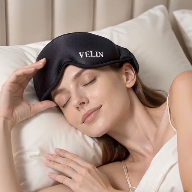 Woman asleep on her side wearing the VELIN Halo Zero Pressure blackout sleep mask